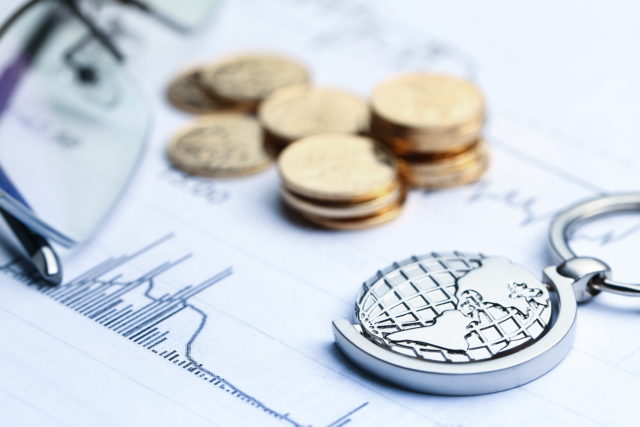 Coins, paper money and globe on white Statistic form background